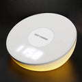 White wireless charger with digital clock display, alarm buttons and night light function
