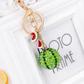 Green watermelon slice shaped zinc alloy keychain measuring 12cm.