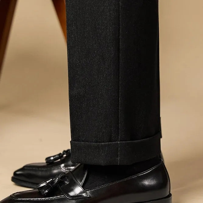 Men's polished leather tassel loafers in black and brown with pigskin lining and rubber sole