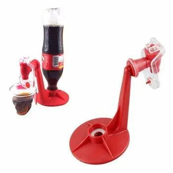 Red plastic Magic Tap soda dispenser attached to 2-liter bottle showing push-in tap mechanism