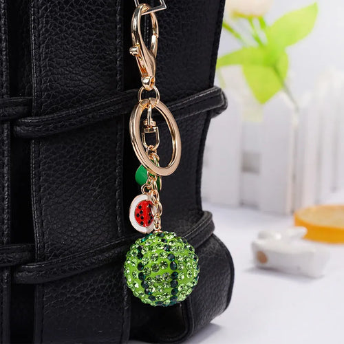 Green watermelon-shaped zinc alloy keychain measuring 12cm.