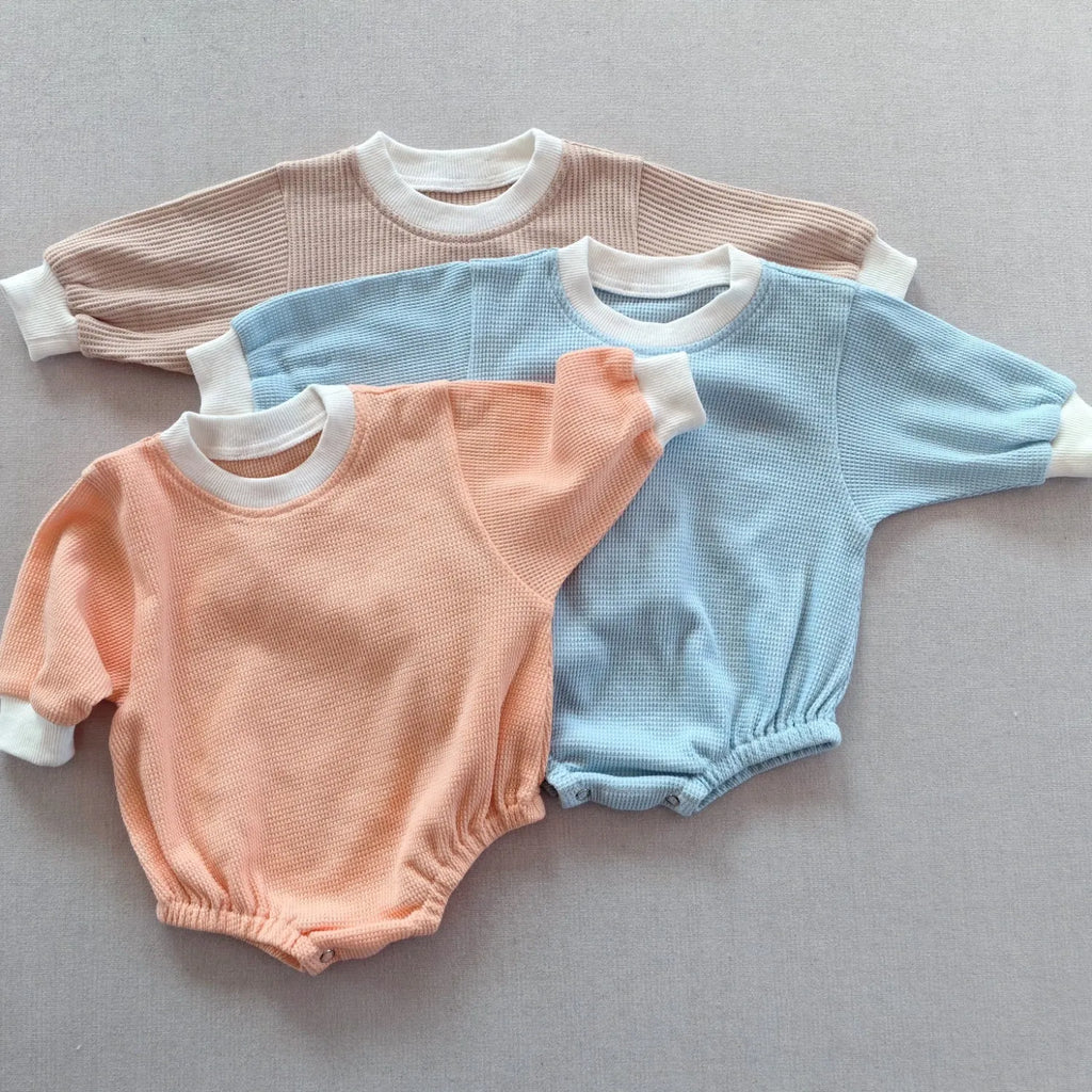 Baby waffle cotton loose triangle jumpsuit bodysuit in coral with hidden hook closure long sleeves