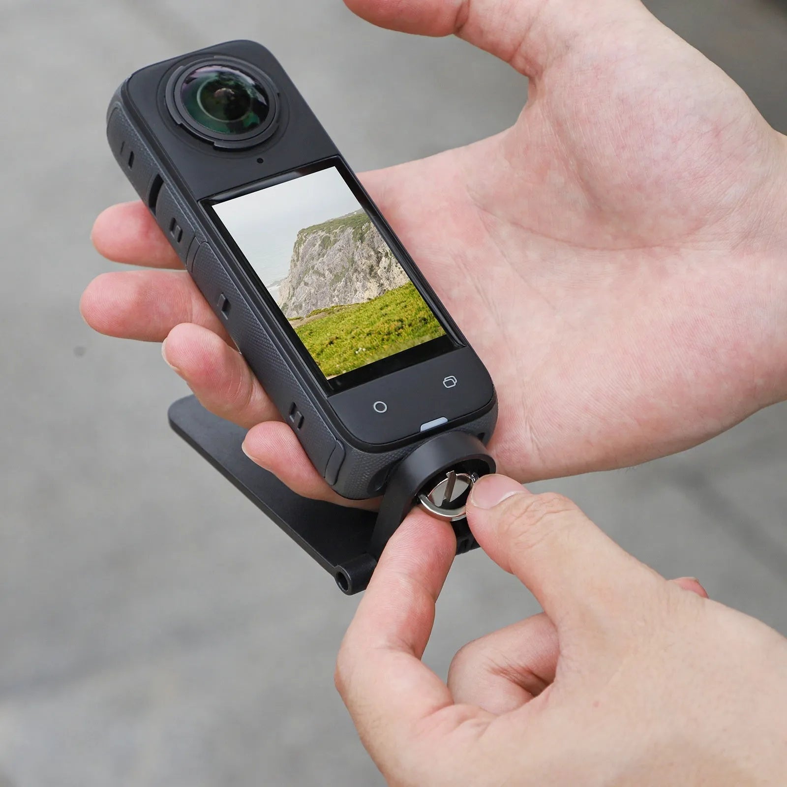 Black magnetic bracket base for Insta360 X4 camera with adjustable angle positioning