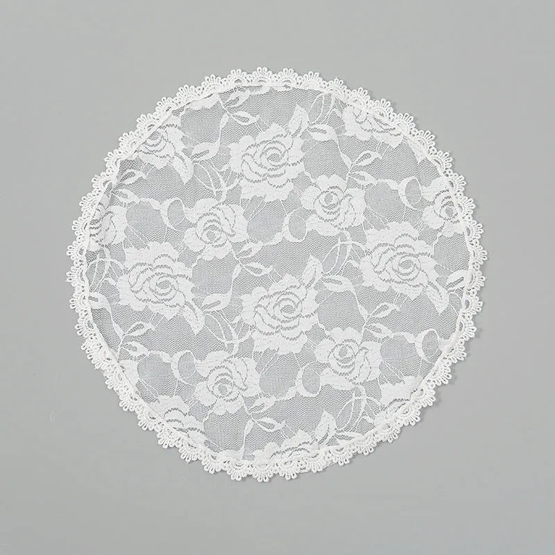 Round wedding veil head covering with floral decoration in black or white colours measuring 30cm diameter