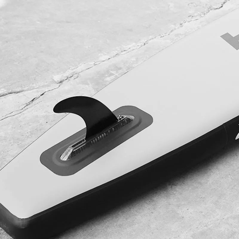 heytur SUP paddle with removable fish fin on the large plastic blade.