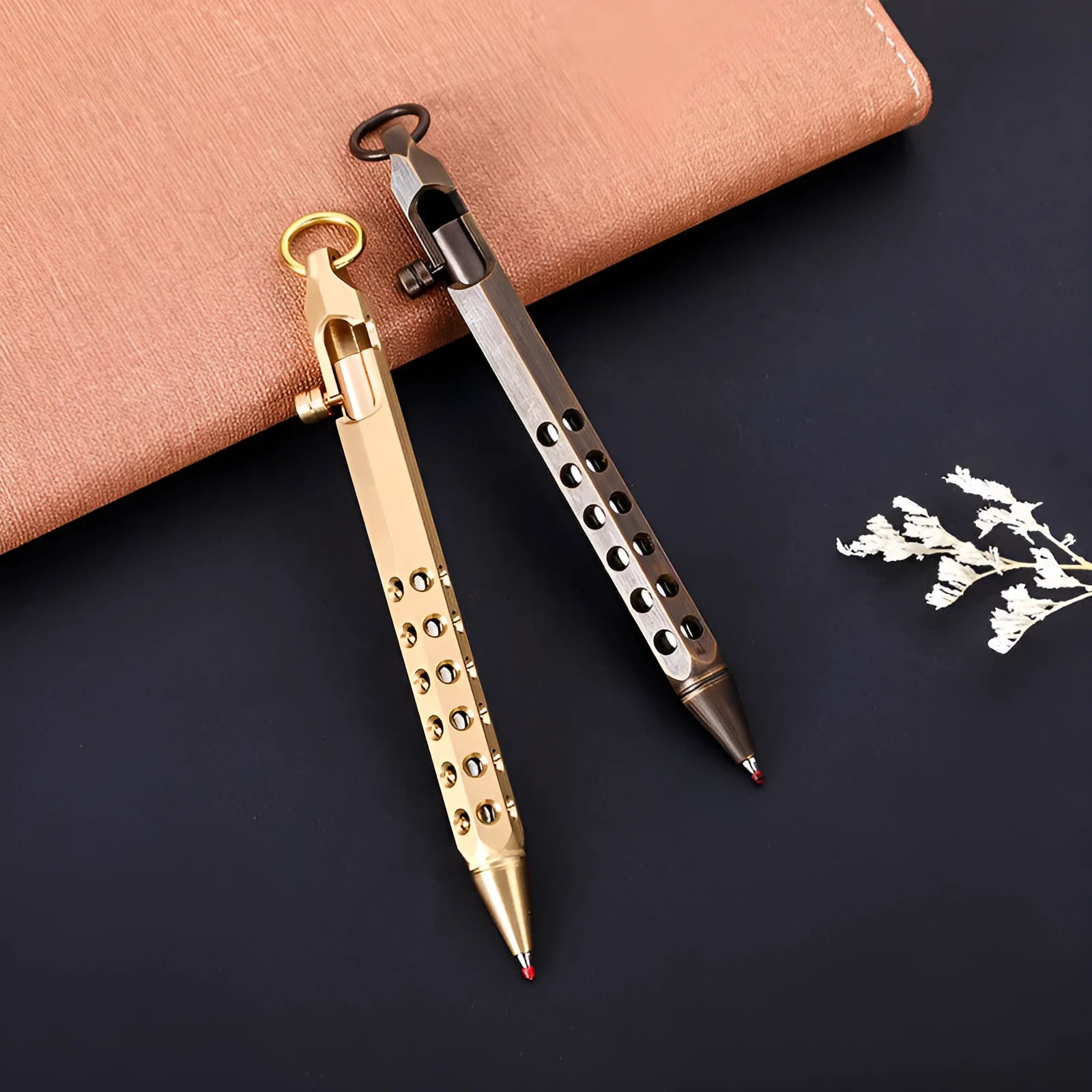 Brass hexagonal bolt-action pen showing six-angle design and bolt mechanism