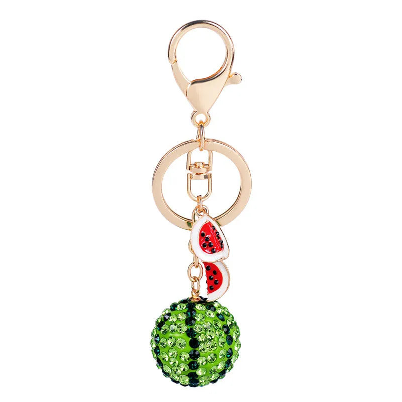 Green zinc alloy watermelon-shaped keychain measuring 12cm in length.