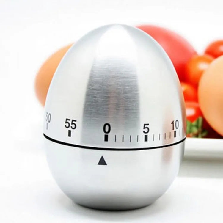 Stainless steel mechanical kitchen timer with egg shape design showing dial and measurement scale