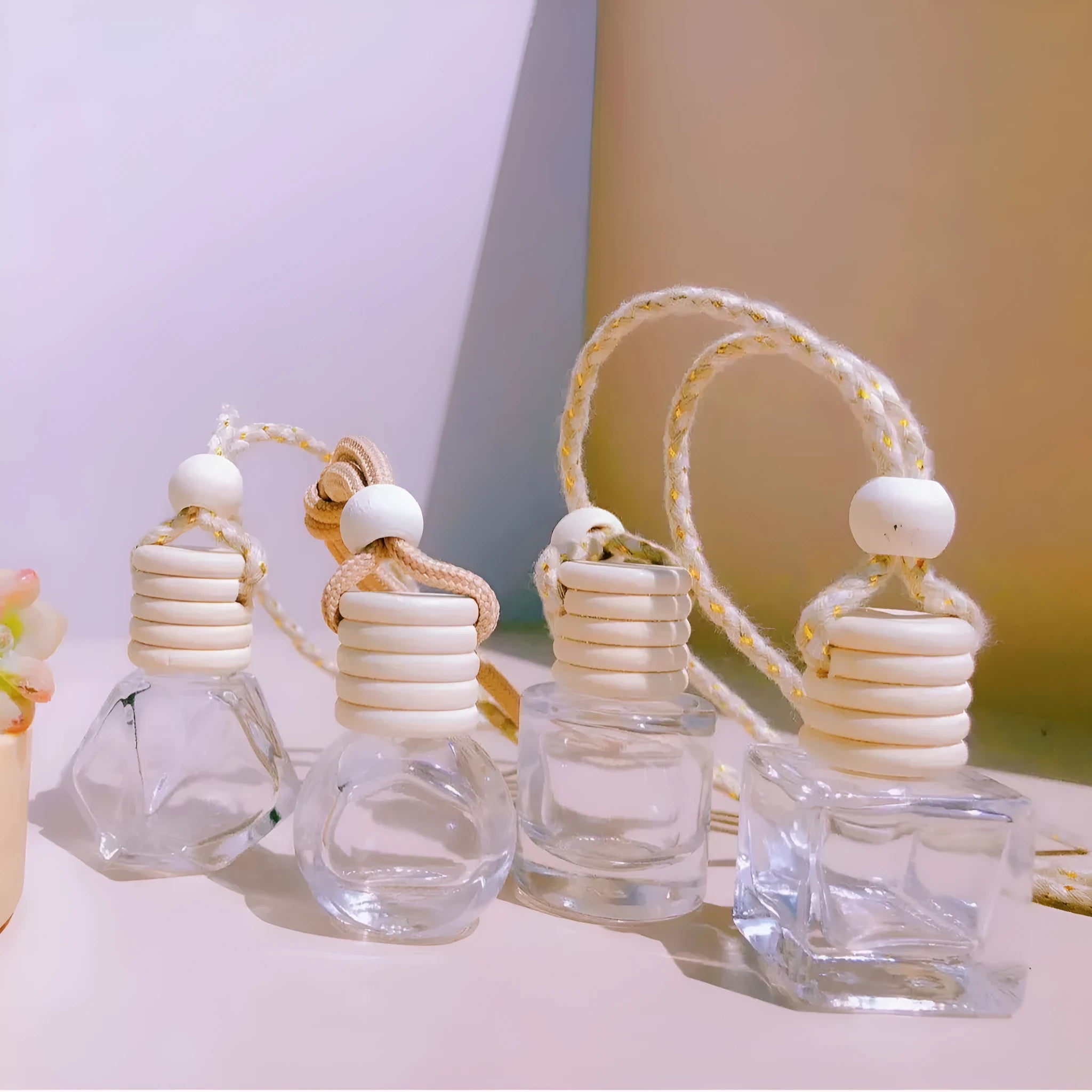 Glass car fragrance pendant showing Cylinder, Diamond, Flat Drum, and Square bottle style options.