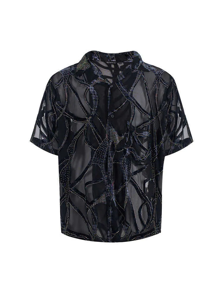 Man modelling a black and grey snake pattern translucent short-sleeved loose-fit shirt