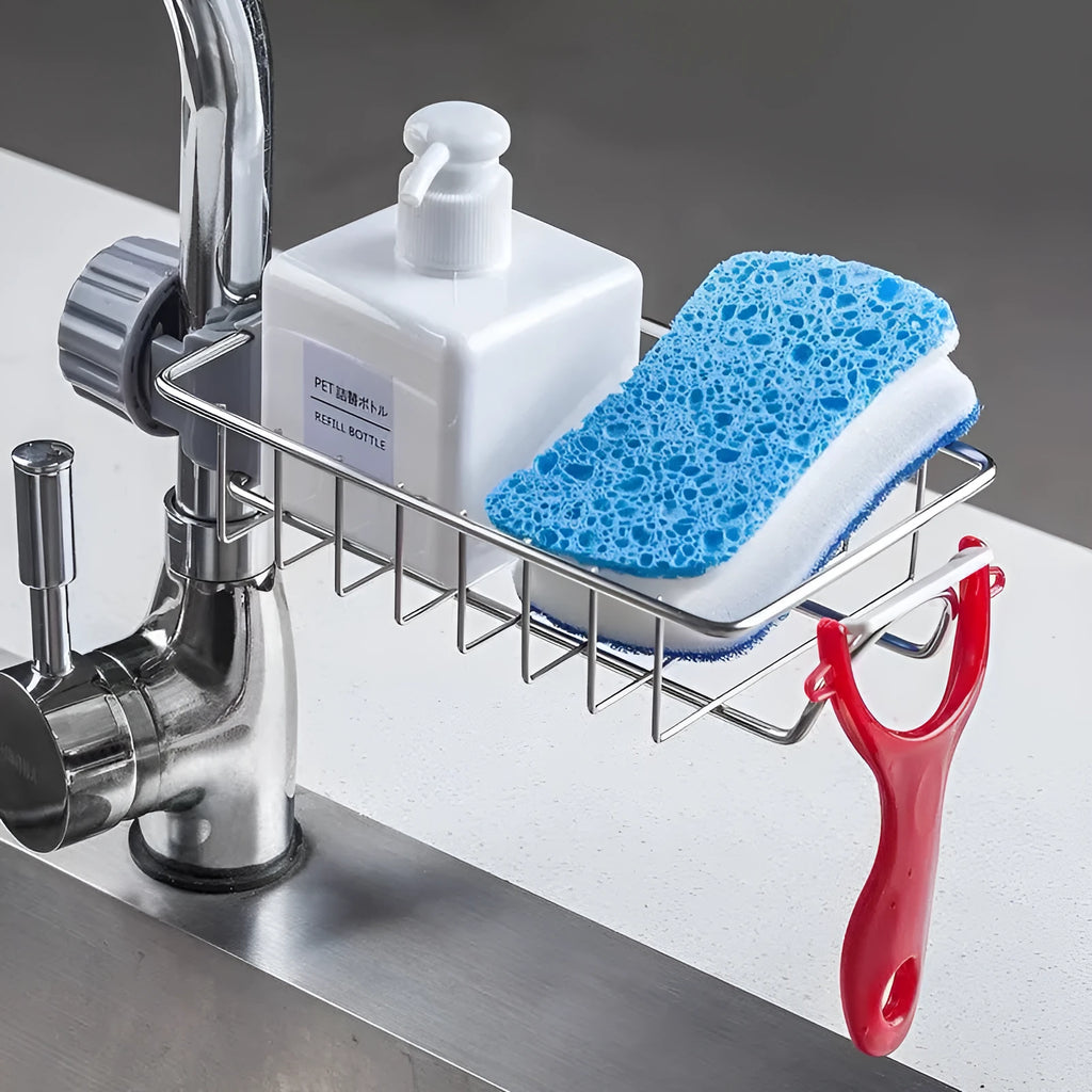 Adjustable stainless steel sink drain rack clipped onto a kitchen faucet with sponge and soap stored on the removable holder