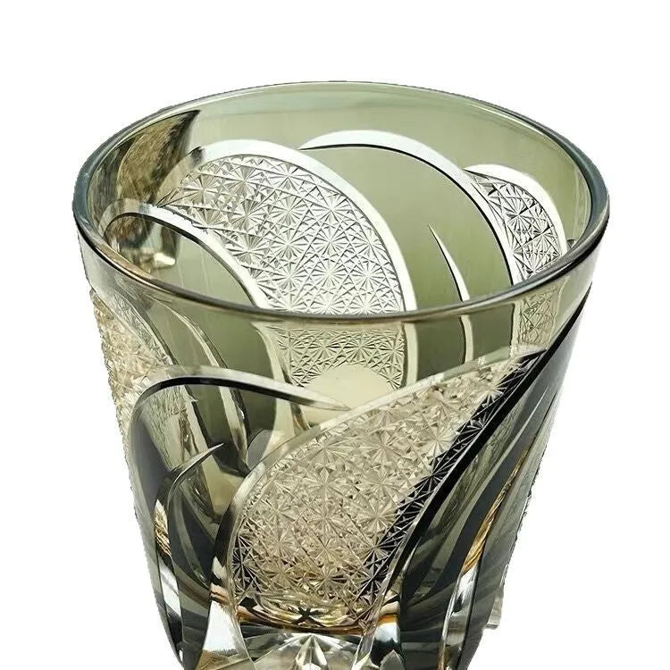 Amber gray crystal glass wine glass with rainbow effect on table, single retro cup