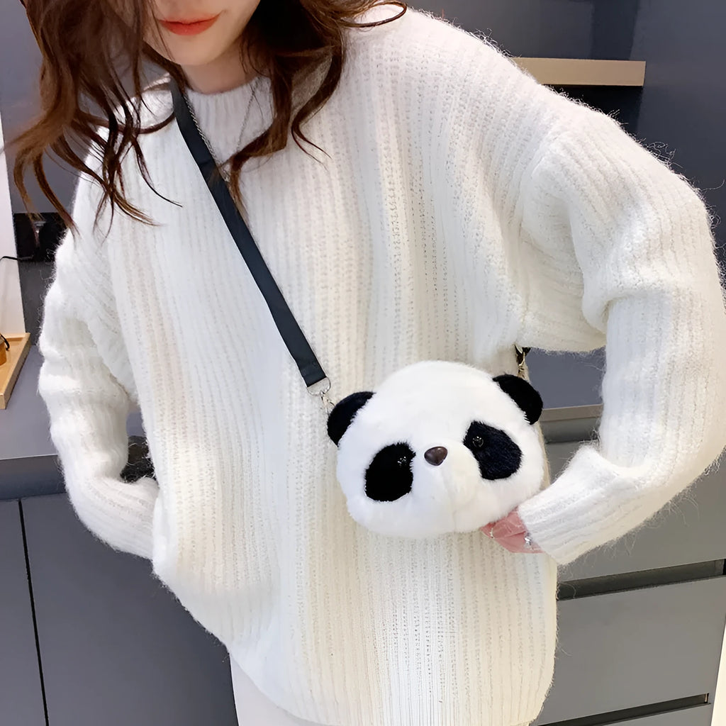 Soft plush crossbody bag in panda head colour with cylindrical shape and sandwich pocket.