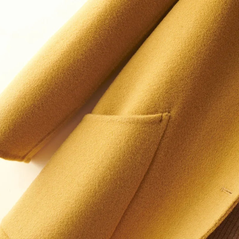 Women's double-faced wool coat with doll collar and pearl buckle in mid-length cut