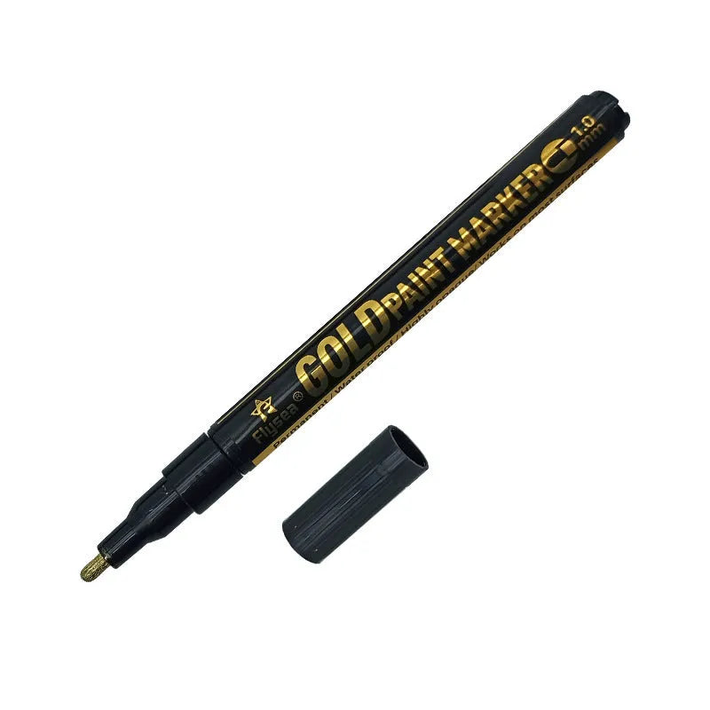 Chrome-plated reflective paint marker pen with 3.0mm tip on glass surface showing silver writing