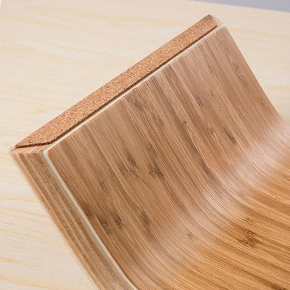 Walnut stability bracket laptop stand in bamboo leather colour, 23x51x9cm, on a desk