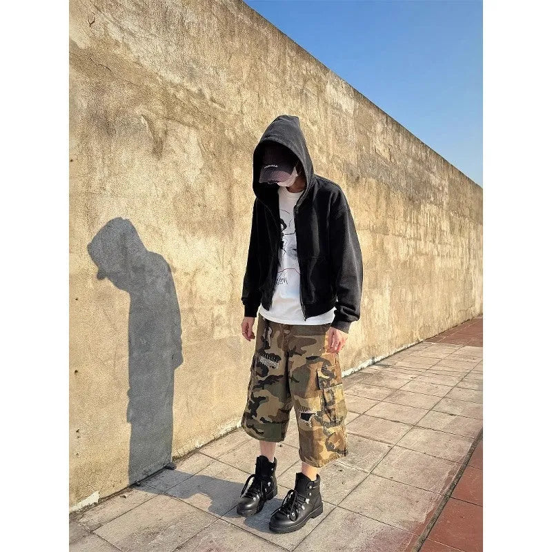 Men's retro patch ripped camouflage cropped jeans showing distressed detailing and straight leg design