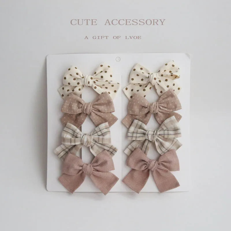 Dovetail bow hairclip set for children in cloth material with eight colour options