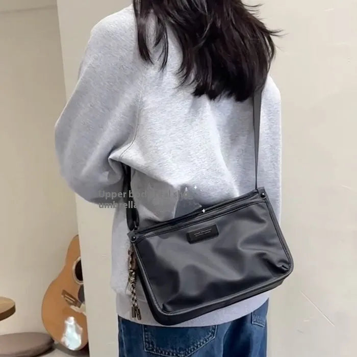 Retro-style small square crossbody bag in Oxford cloth for unisex casual and travel use