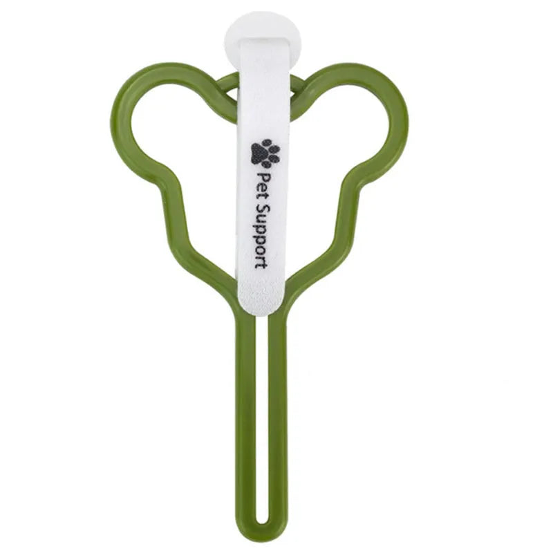 Dog poop bag holder with clip and velcro strap for leash attachment.