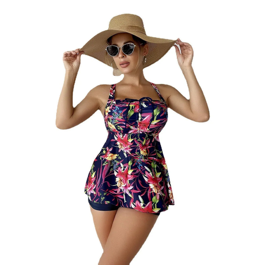 Women's floral print bikini set with a skirt-style high-waist bottom, shown in a blue pattern colour.