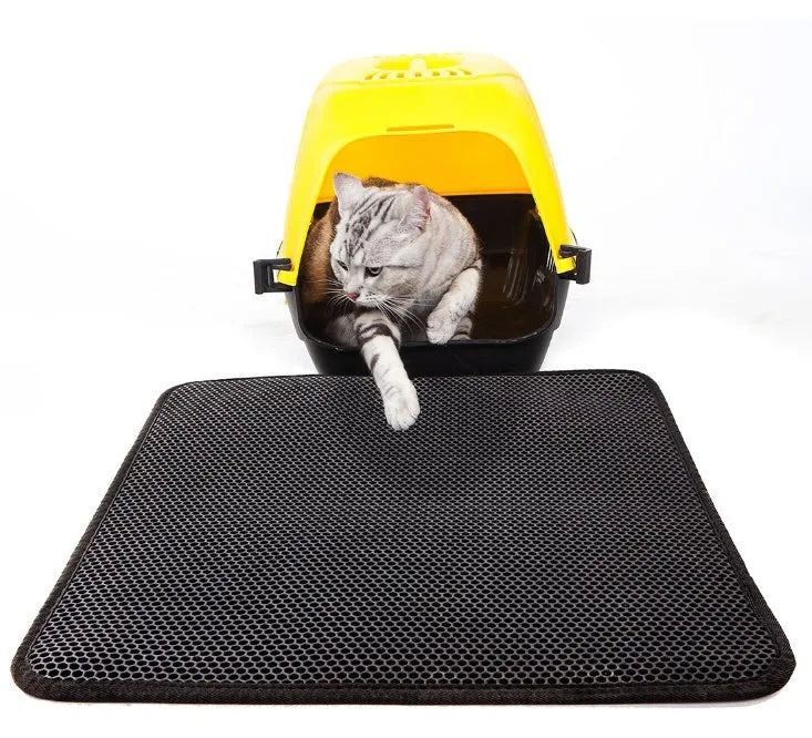 Waterproof EVA double-layer cat litter mat in black honeycomb design, size L foldable, placed under a litter box