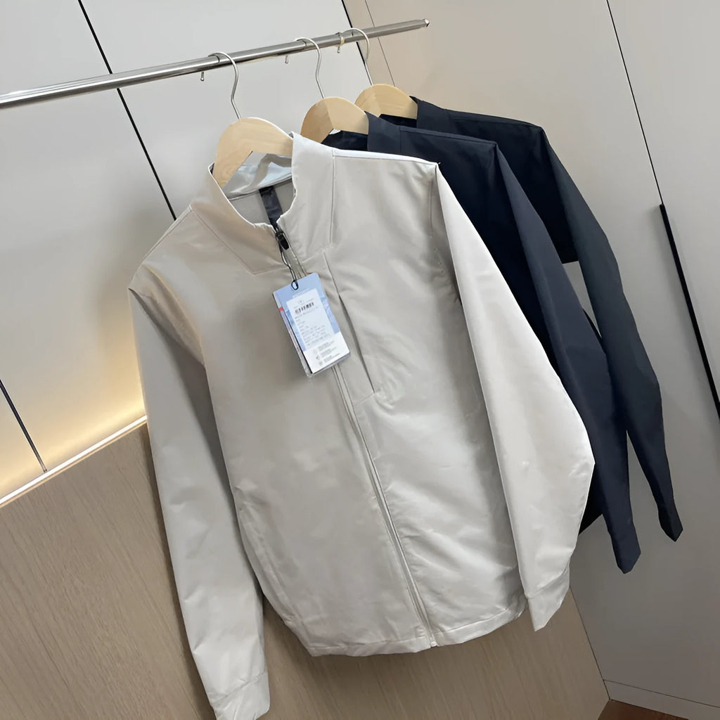 Men's stand collar casual jacket in polyester, shown in black, dark blue, or milky white.