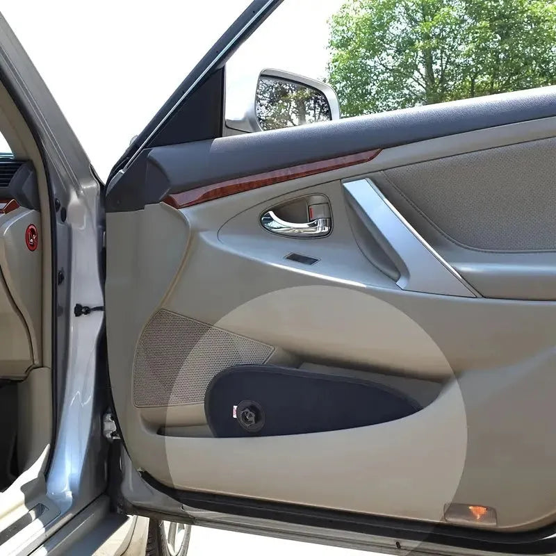 Black stretchy car side window sunshade with suction cups fitted on a car window