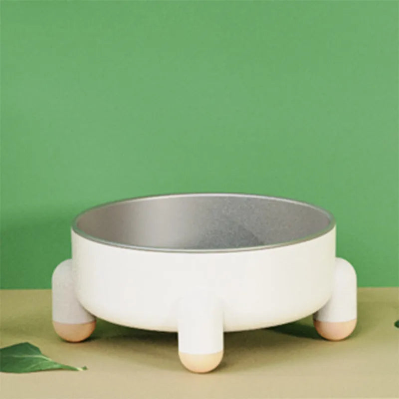 Stainless steel non-slip pet bowl with raised feet in green, pink, and white colour options.