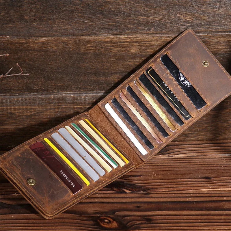 Men's long leather card wallet in crazy horse hide with 18 card slots and a phone compartment.
