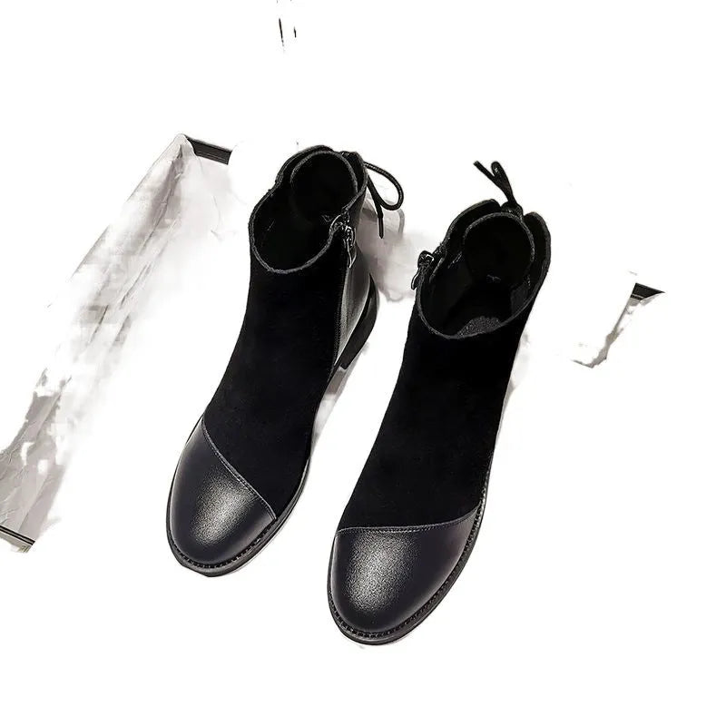 Black women's knee-high Martin boots with side zip and bow detail on a microfibre upper.