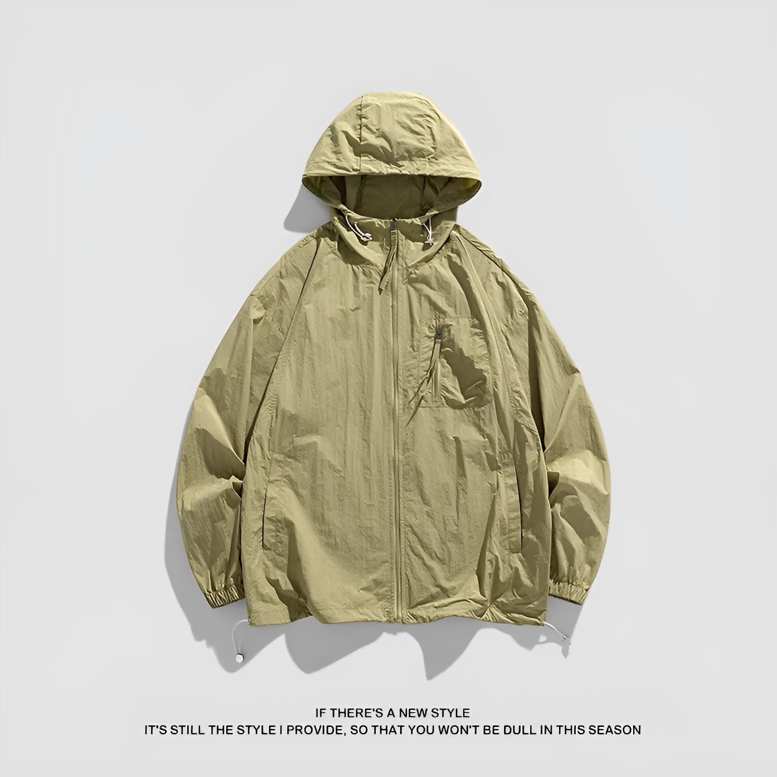 Lycra hooded sun protection jacket in light army green colour on a hanger