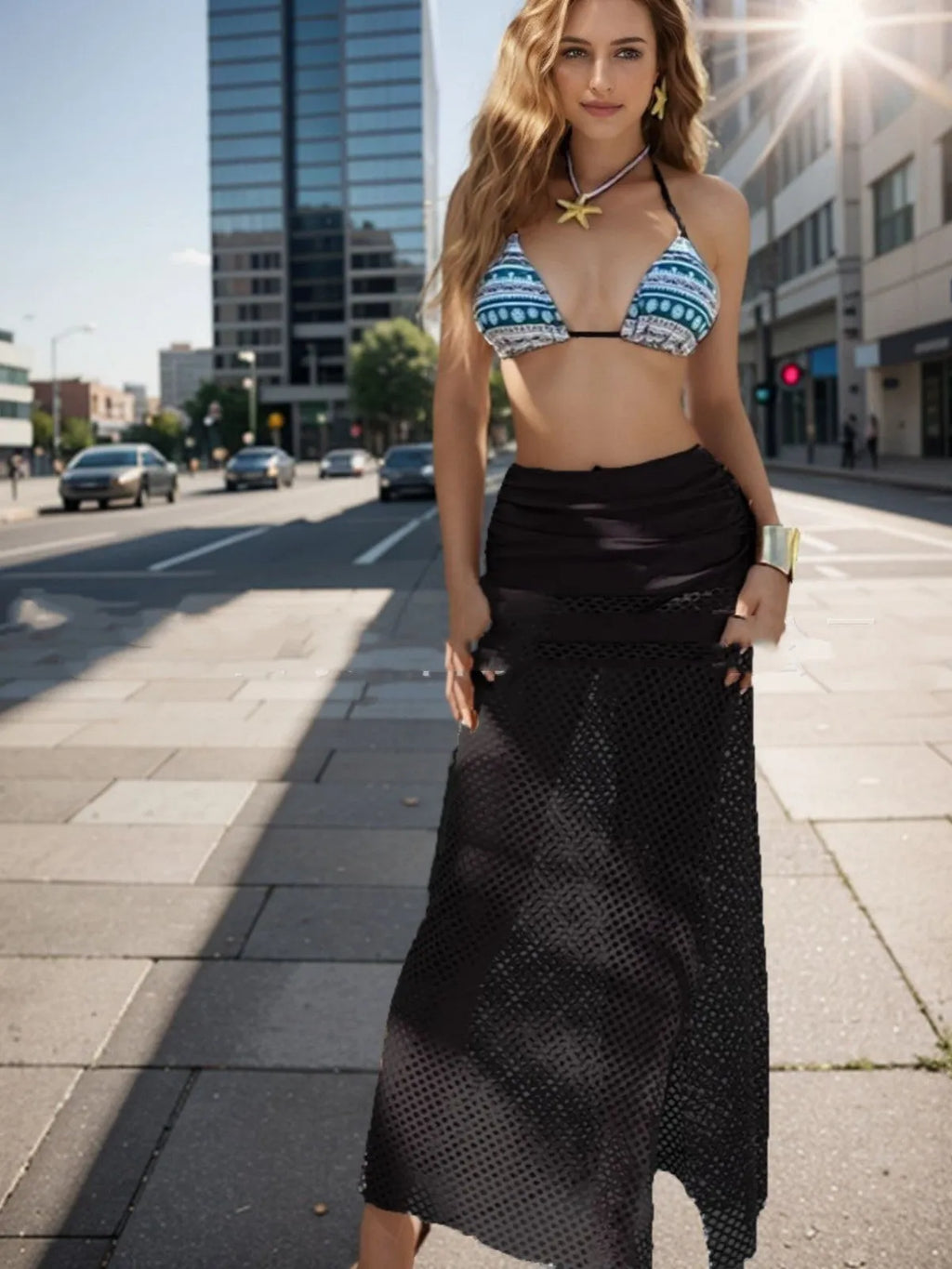 Women's brown gradient three-piece bikini set with fishnet long skirt laid flat.