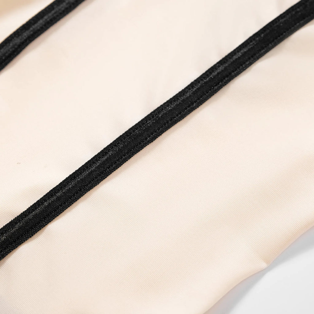 Women's khaki and white contrast colour sleeveless bodybuilding jumpsuit with shorts and hollow-out detailing.
