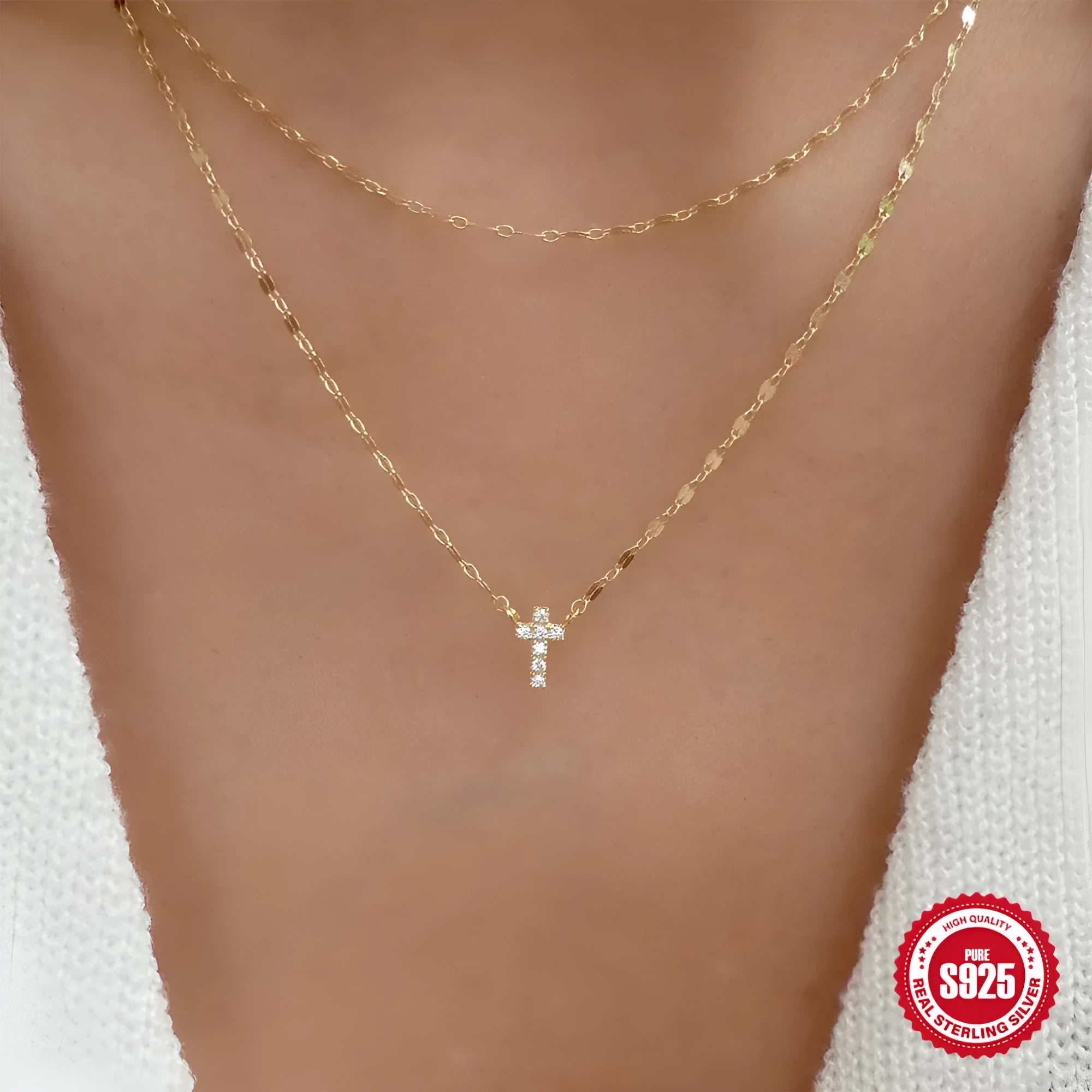 Close-up of a sterling silver double layer twin diamond cross pendant necklace on an adjustable chain.