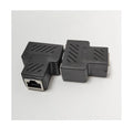 Two white RJ45 three-way tee network cable splitters on a dark surface.