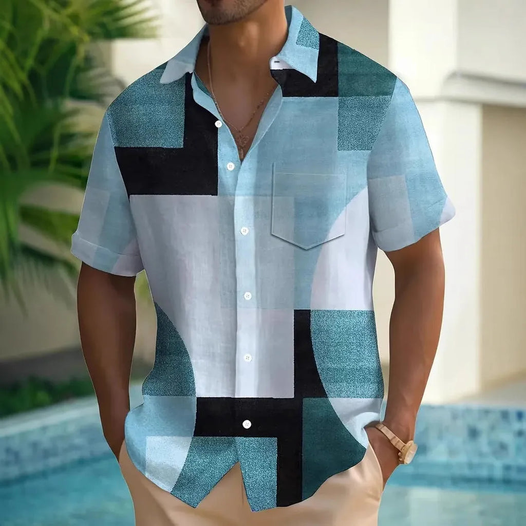 Man wearing a loose-fit short sleeve cardigan shirt with a blue and white 3D printed geometric square pattern.