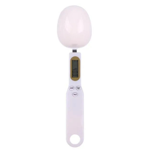 White digital kitchen spoon scale with LCD display showing weight measurement