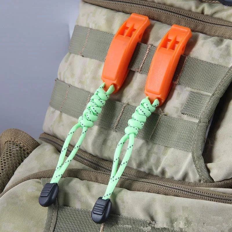 Fire survival whistle in black or orange, high impact plastic, 7.2cm x 2cm, with 10cm or 50cm lanyard