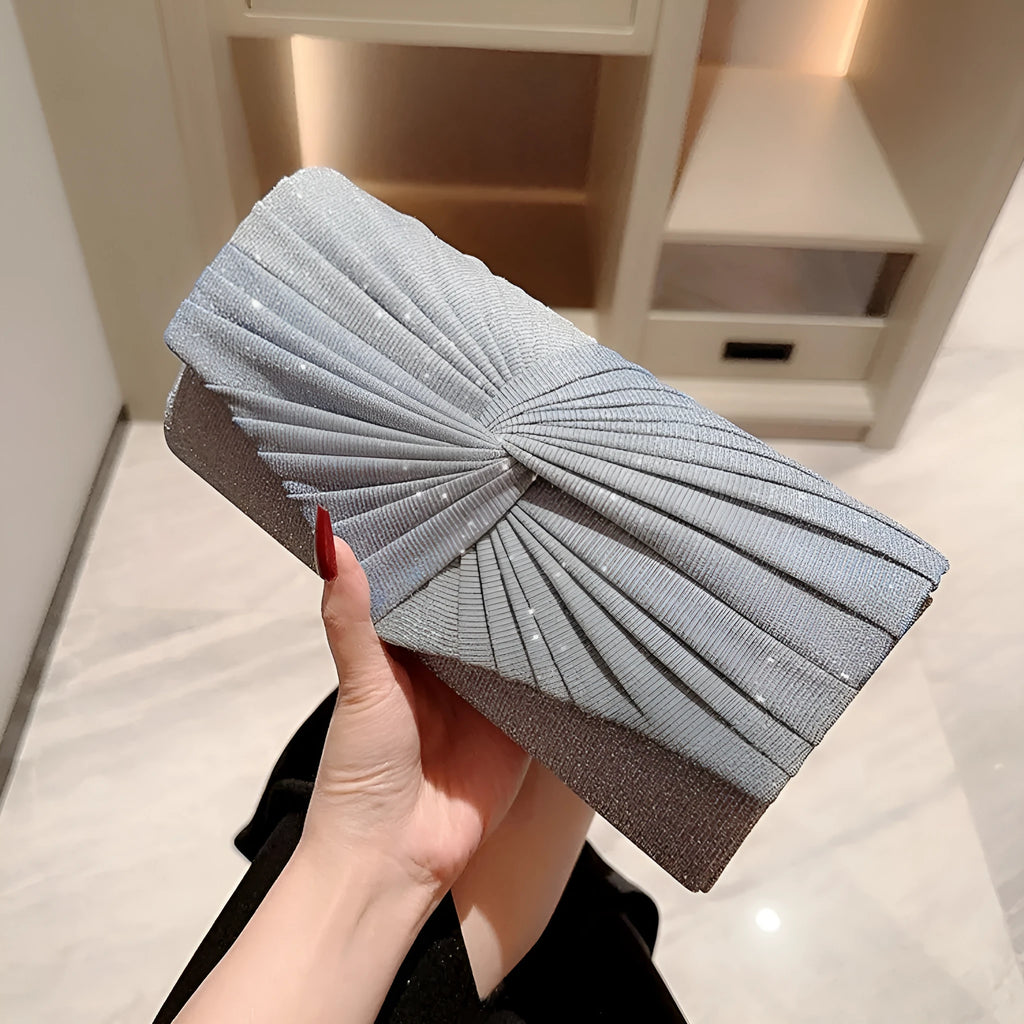Horizontal square dinner clutch in silver or gold with woven exterior, open pocket, and internal phone bag.