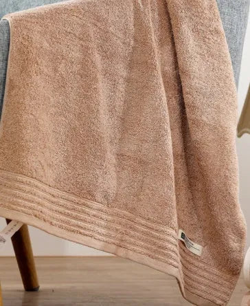 Cotton towels set showing bath, hand and guest towels in brown colour