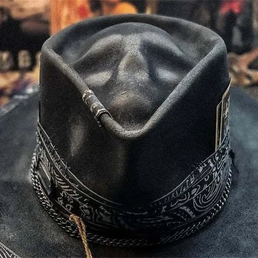 Handmade grey wool felt conical hat with a black embroidered skull design on the front.