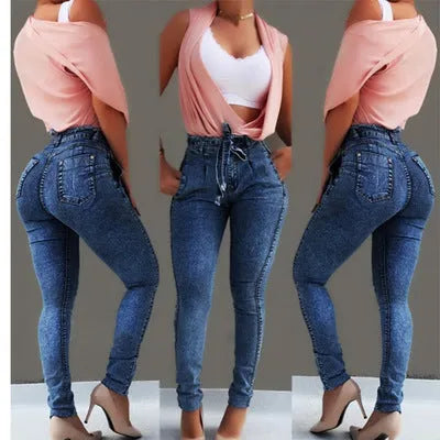 Women's fringed jeans in light blue, grey, and dark blue cowboy fabric, showing detailed fringe hem.