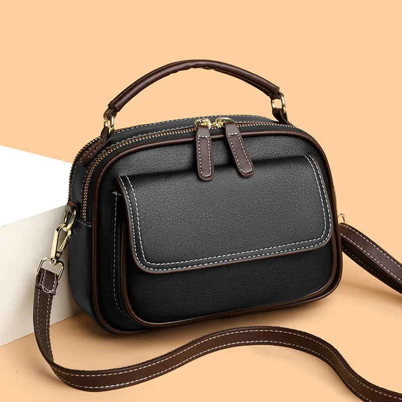Women's black PU cross-body shoulder bag with square shape and adjustable double straps