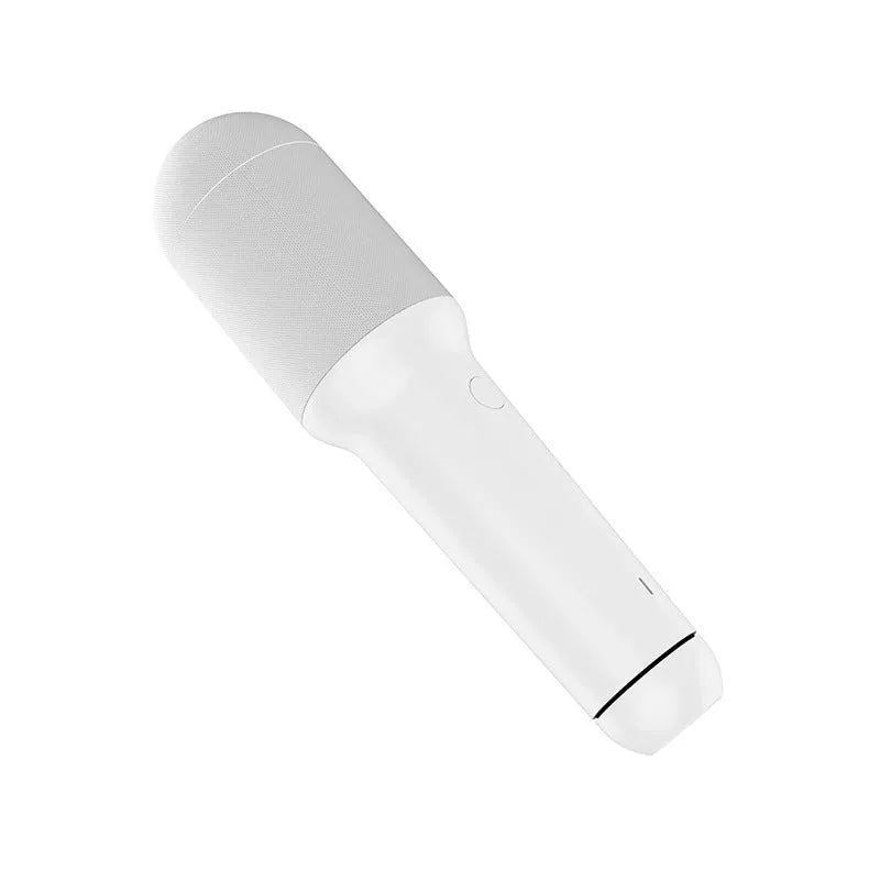 White wireless karaoke microphone with built-in speaker and metal mesh grille on a plain background