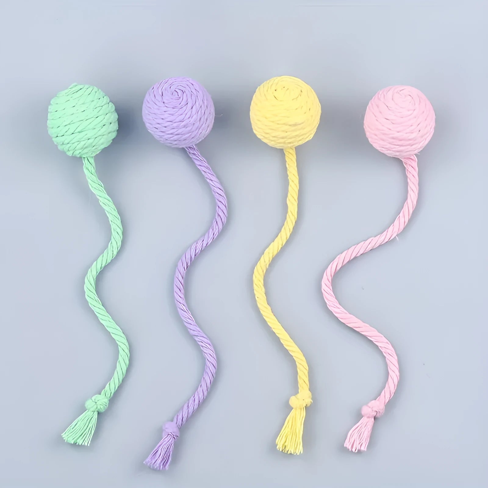 Colourful cat toy ball with rope attachment and built-in bell for interactive pet play