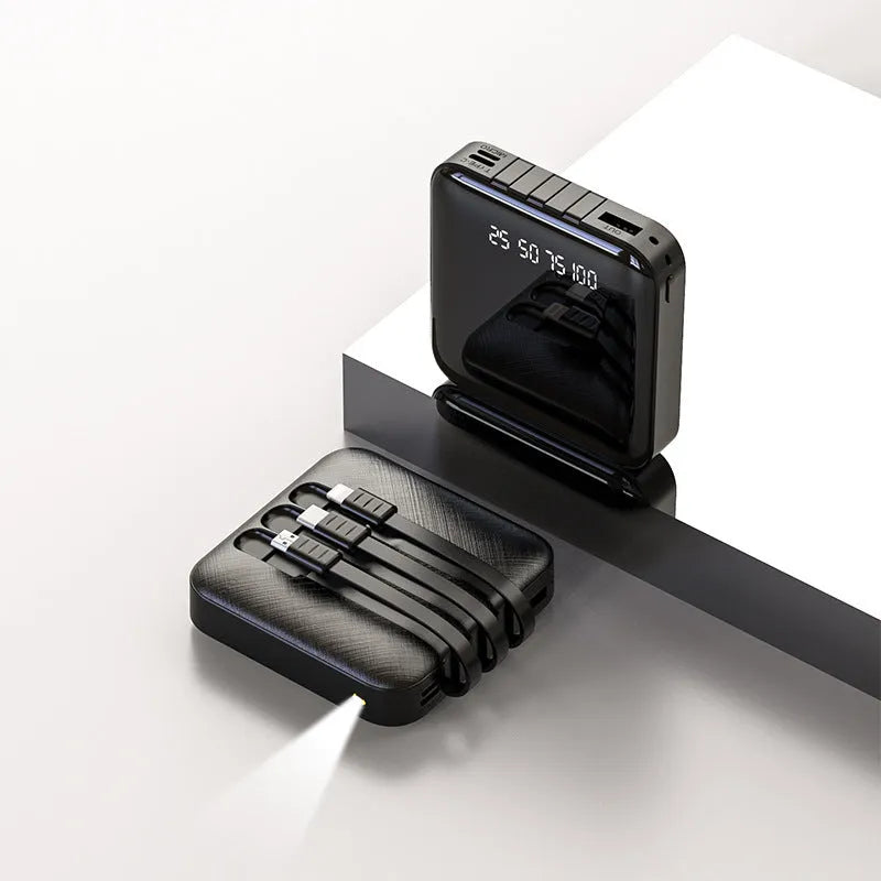 Square black power bank with a built-in USB charging cable, showing 10000mAh capacity label.