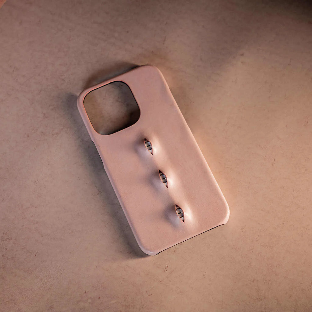 Pink eye-shaped phone case in waxed vegetable-tanned cowhide with PC bottom shell for iPhone