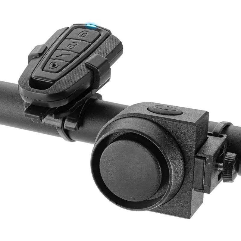 Black ABS rechargeable bicycle and motorcycle alarm with remote control and USB cable, showing compact unit and remote