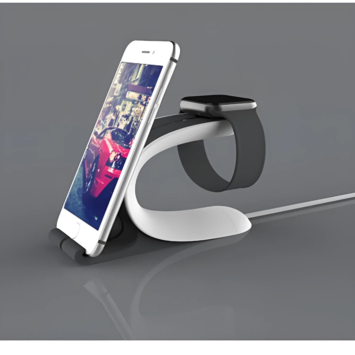 Grey Apple Watch and iPhone charging stand on desktop